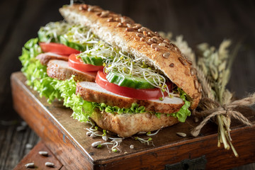 Fresh sandwich with grilled chicken, lettuce and tomatoes