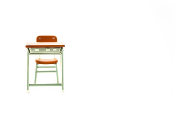 Miniature school study desk on a white background