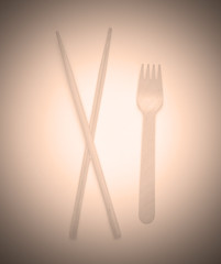 Eco cutlery. Chinese chopsticks, wooden fork. Top view