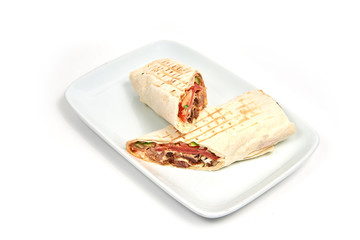 Cut shawarma on white plate