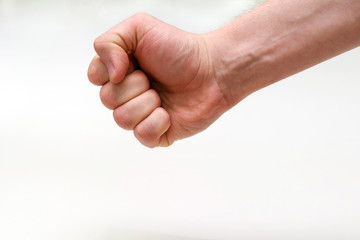 A man's Clenched Fist, a swing. Isolated On a White background. Copy space