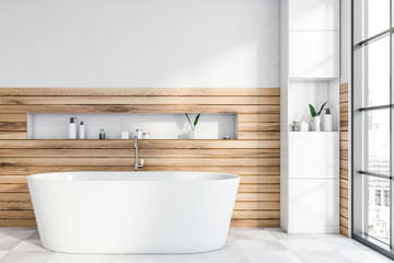 Obraz na płótnie Canvas White and wooden bathroom with tub