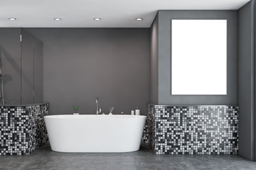 Gray mosaic bathroom with tub and poster