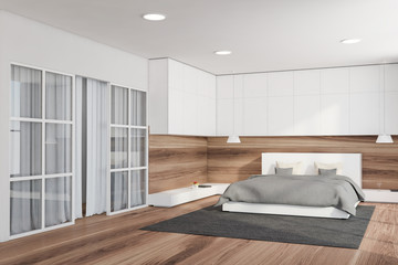 Fototapeta na wymiar White and wood bedroom corner with glass door