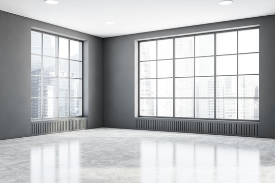 Empty gray room corner with windows
