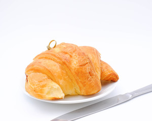Breakfast served with croissants. Balanced diet.
