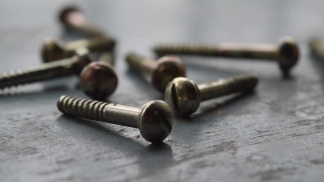 Screw on rusty metallic surface. Close Up. Screws Industrial Background Texture. Selective focus. Business Industry concept. Copy space.