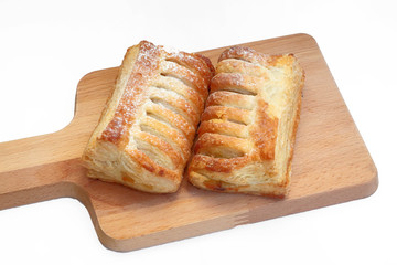 ITALIAN CRISPY DESSERT PASTRY ON A WOODEN CUTTING BOARD
