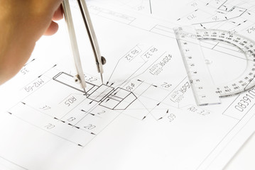 hand measures drawing, compass, protractor