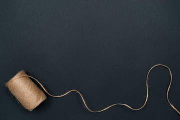 Hemp twine. Natural materials for crafts. Top view with copy space, flat lay.