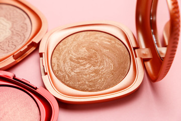 Set of professional elite decorative cosmetics for makeup on a pink background. The concept of beauty and fashion. Mua and girly concept. Eye shadows cosmetics product as luxury beauty brand promotion