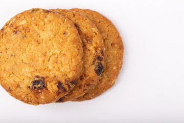 Delicious Oat cookies raisins with wholegrain on a white background.