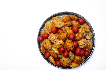 Tasty asian vegetarian appetizer, crunchy rice en peanuts snacks from Japan isolated on white backgound