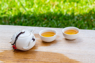 Man hand pouring Tea on Chinese tea cup. Chinese Traditional culture of Traditional Tea Ceremony Utensils, Chinese Teacup
