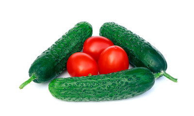 Organic, raw vegetables isolated.Tomatoes and cucumbers isolated on a white background.