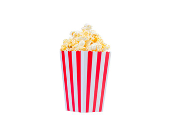 Popcorn in red and white striped cardboard bucket isolated on white background. Movie Popcorn isolated on white with clipping path. Tasty salted popcorn in striped paper cup .