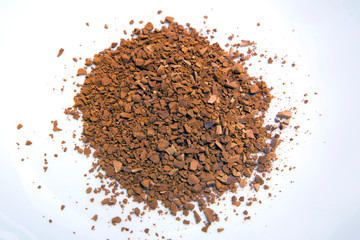 Instant coffee granules in a white mug
