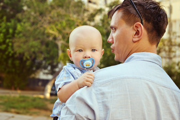 baby boy on father hands