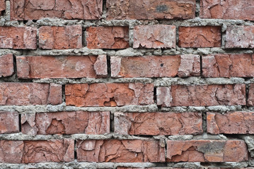 old red brick wall with crumbling stones