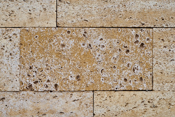 Sandstone building blocks. Rough texture of a brick wall made of sand and shells, appearance.
