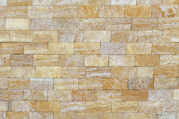 Obraz premium Sandstone building blocks. Rough texture of a brick wall made of sand and shells, appearance.