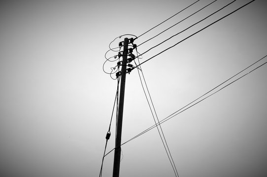 Low Angle View Of Power Lines Against Clear Sky