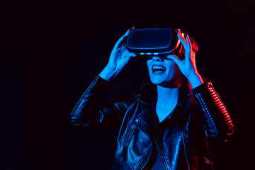 girl gets the experience of using virtual reality glasses