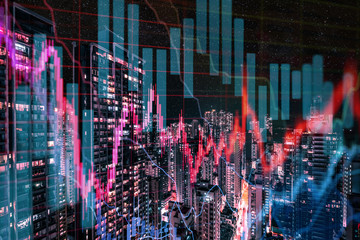  stock market chart and skyline at night - real estate business concept