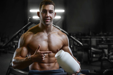 Fototapeta na wymiar Bodybuilder protein powder after fitness workout