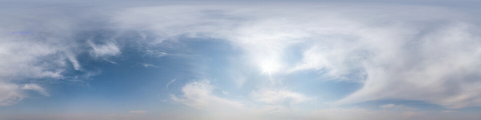 Seamless hdri panorama 360 degrees angle view blue sky with beautiful fluffy cumulus clouds without ground with zenith for use in 3d graphics or game development as sky dome or edit drone shot