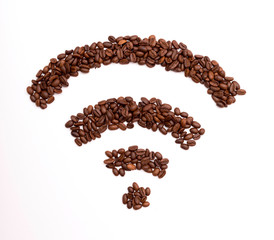 Wi-Fi symbol folded from roasted coffee beans on the basis of burlap. Wifi sign made of roasted coffee beans.