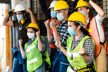 industry engineer team Asian wearing uniform and hard hats happy and celebrating success at Metal lathe industrial manufacturing factory. Engineer Operating  lathe Machinery