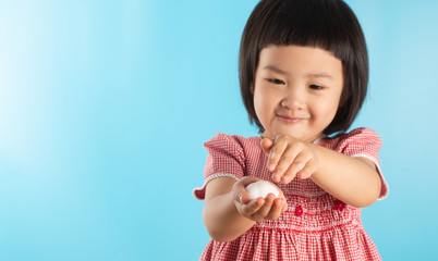 Cute Asian girl washing hands with soap bubbles to kill bacteria COVID - 19 for good health with fun and happiness. With copy space.