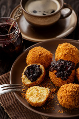 Homemade cottage cheese balls, hungarian sweet dessert served with berry jam.