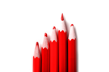 One sharpened pencil standing out from the blunt ones. It's easy to be beautiful if you do nothing concept. Red pencils on white.