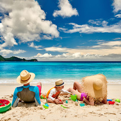 Family with three year old boy on beach