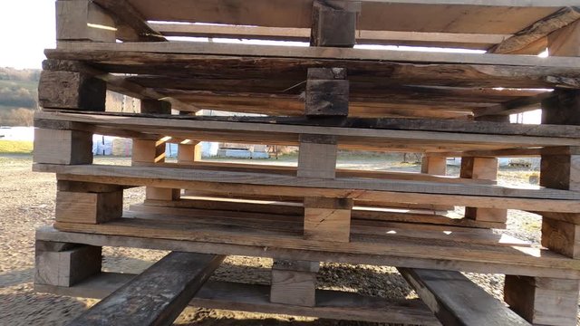 Forklift traveling with stack of pallets and release