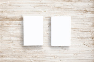 Top view of carton business cards on wooden background. illustration of vertical stacks to showcase your presentation.