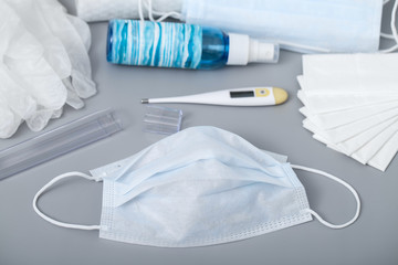 Protection from viral infections, transmitted by airborne droplets. Medical mask, a bottle of...