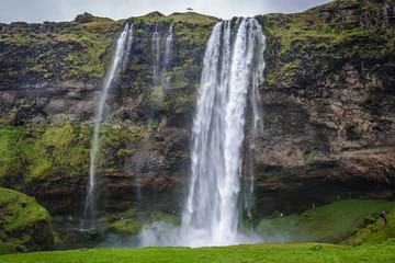 Famous Seljalandsfoss waterfall, part of Seljalands River that has its origin in the volcano glacier Eyjafjallajokull in Iceland