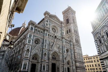 Fototapeta premium Sunshine at the front gate of the famous Cathedral of Florence, Italy. October 2017