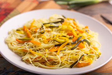 Rice noodles with vegetables. Traditional Asian dish