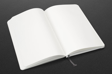 Opened sketchbook with blank and white pages on dark background. illustration to showcase your artwork presentation.