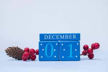A festive clean Christmas-themed scene with calendar blocks for 1 December date