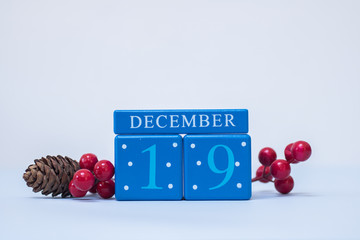 A seasonal clean Christmas-themed scene in blue and red with calendar blocks for 19 December date