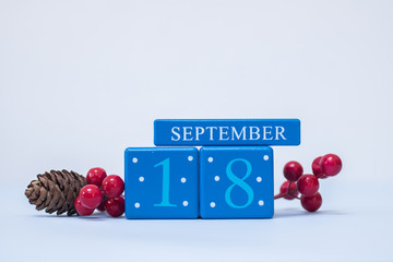 A seasonal clean Christmas-themed scene in blue and red with calendar blocks for 18 December date