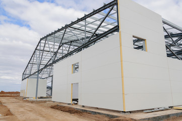 Construction of buildings made of steel structure and sandwich panels. The use of modern building materials