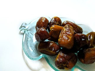 date palm on a plate isolated on white background