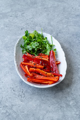 Antioxidant Salad Julienne Sliced Red Bell Pepper Slices and Parsley with Sesame Seeds and Olive Oil.