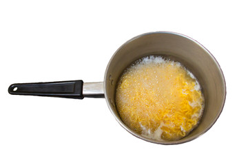 Boiling noodle in a pot with handle isolated on white background with clipping path